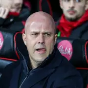 Liverpool's Left-Back Dilemma: Robertson Stays as Tsimikas Talks with Roma Continue