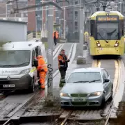 Manchester Metrolink Chaos as BMW Abandoned on Tram Tracks