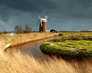 Norfolk Broads Storm: Windpump Stands Against Nature's Fury