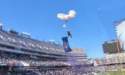Parachutist Plunges 40 Feet Into Crowd After Tangling in Field Goal Net