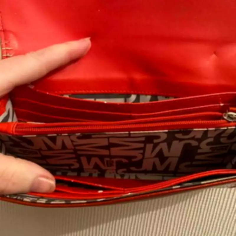 Charity Shop Buyer's 50p Purse Purchase Reveals Sentimental Photo Mystery