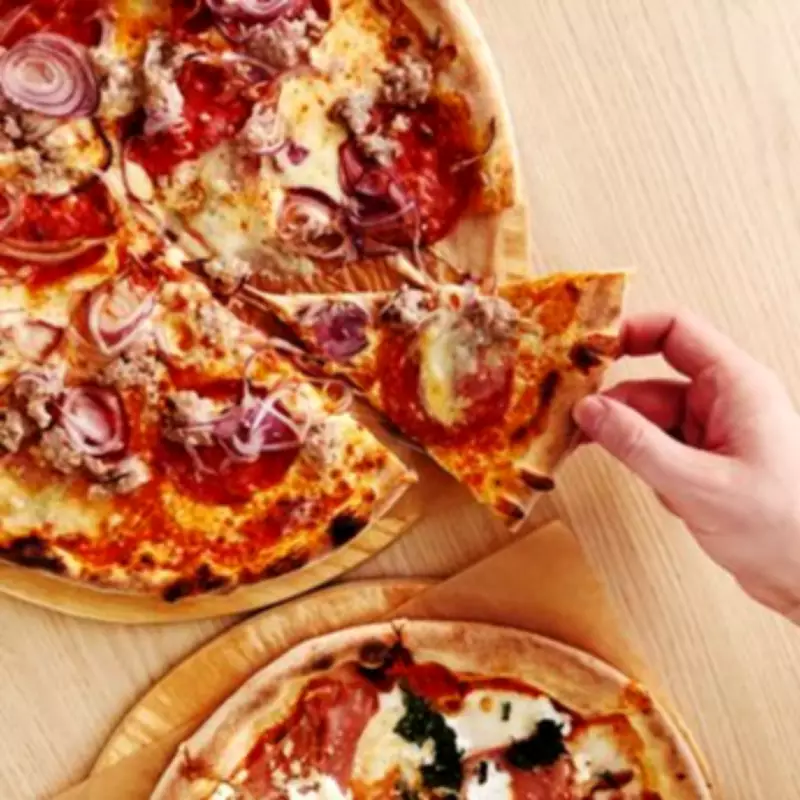 Etiquette Expert Settles Pizza Debate: Hands or Cutlery?