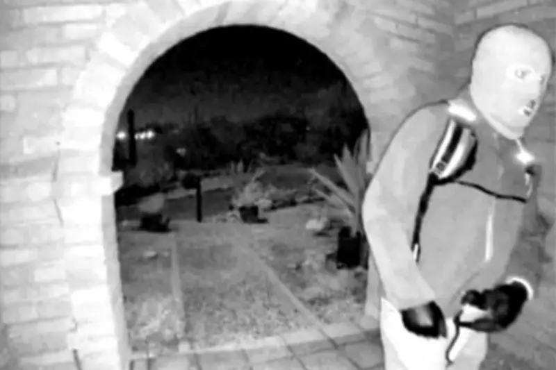 FBI Releases Surveillance Photos of Armed Masked Individual at Missing Woman's Door