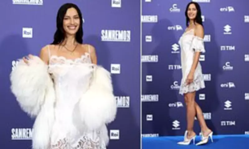 Irina Shayk Stuns at Sanremo Festival Photocall in White Lace Dress