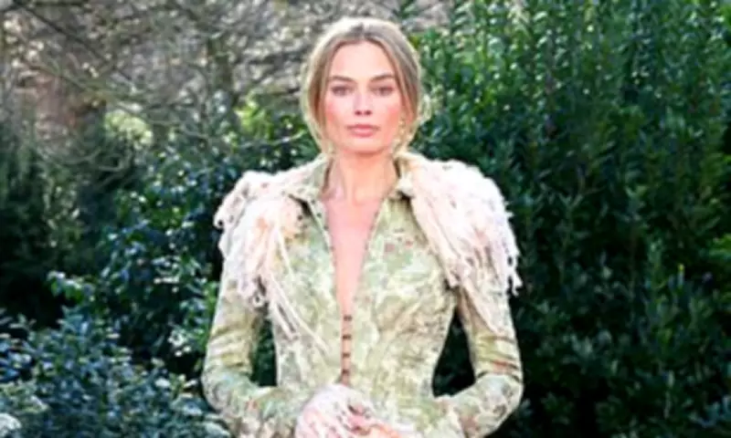 Margot Robbie Stuns in Period Style Coat at London Wuthering Heights Photocall