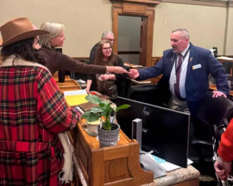 Wyoming Political Storm as Activist Hands Checks to Lawmakers on House Floor