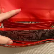 Charity Shop Buyer's 50p Purse Purchase Reveals Sentimental Photo Mystery