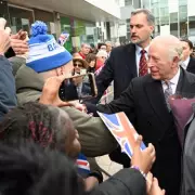 King Charles and Camilla's East End Visit Overshadowed by Protests and Cheers