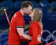 Married Couples Compete Together at Cortina Winter Olympics Curling Event