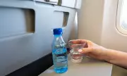 Passenger's Bottle Opening Request Sparks Online Debate Over Flight Attendant Etiquette