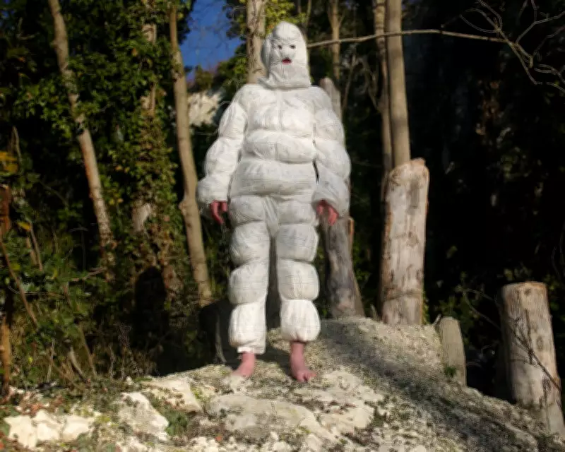 Artist's Nappy Costume Performance Highlights Sewage Crisis and Personal Struggle