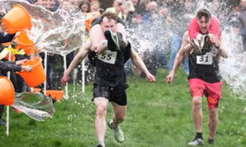 Finnish Pair Triumph at UK's Chaotic Wife Carrying Race in Dorking