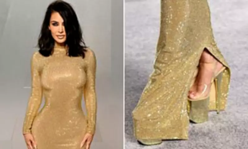 Kim Kardashian Struggles in Gold Gucci Gown at Vanity Fair Oscars Party
