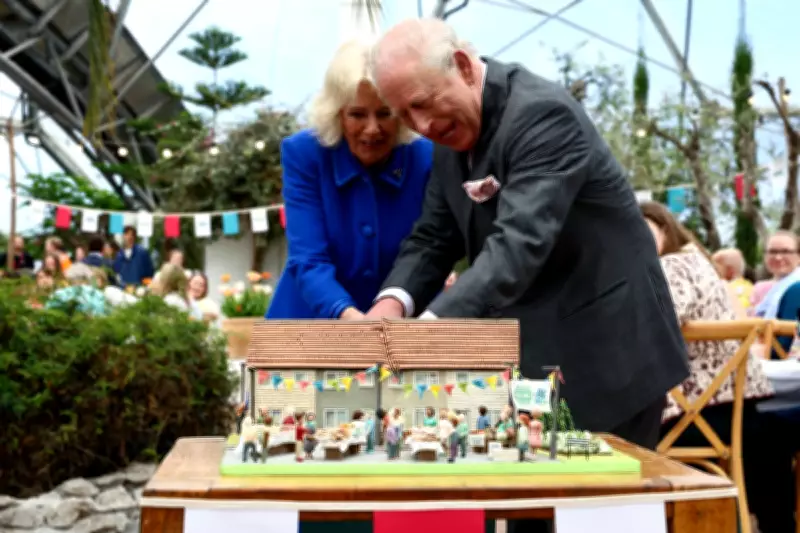 King Charles and Queen Camilla Share Laughter While Cutting Cake with Sword at Eden Project