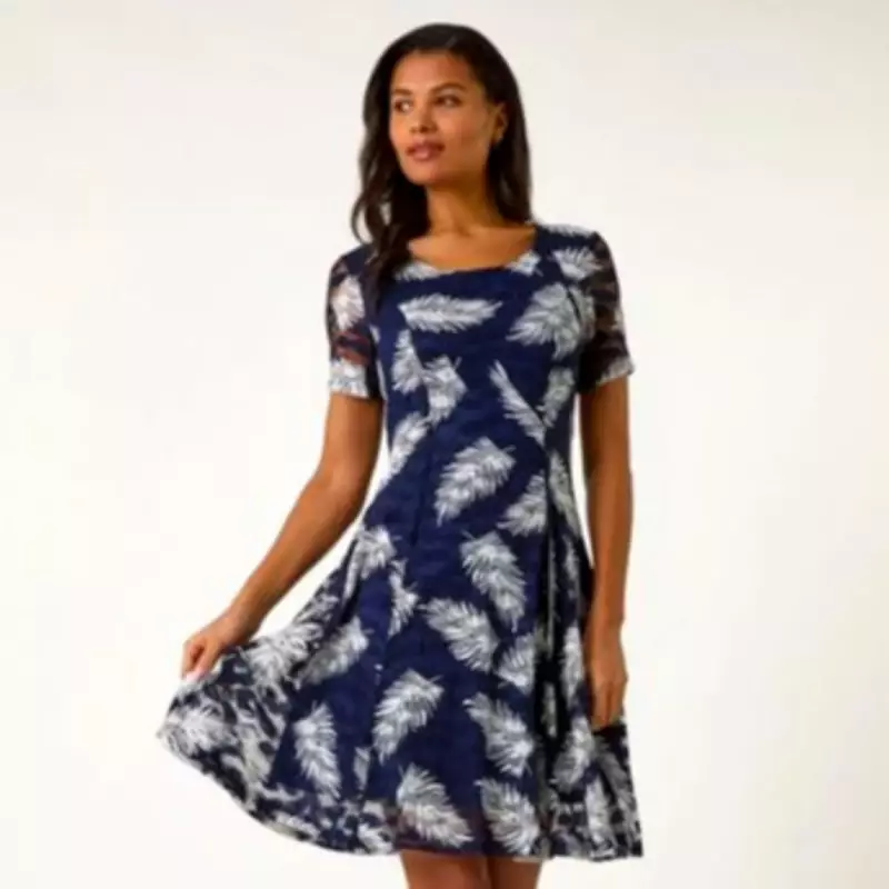 Roman's Navy Leaf Print Lace Dress Earns Praise for Spring Style