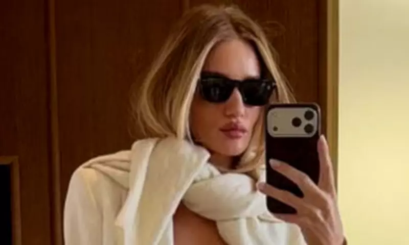Rosie Huntington-Whiteley Stuns at Paris Fashion Week with Chic White Suit