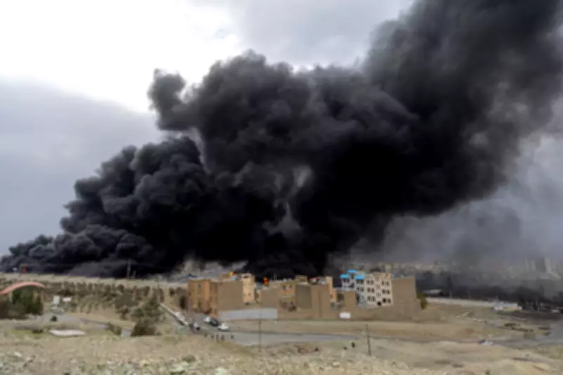 Tehran Skyline Shrouded in Smoke Following Israeli Strikes on Oil Facilities
