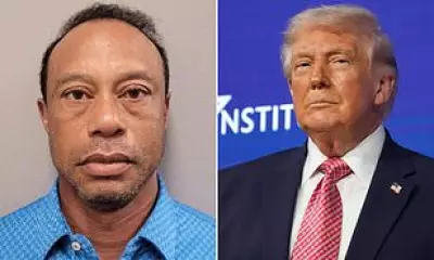 Anti-Trump Protester Mocks Tiger Woods' DUI Arrest at Nationwide Demonstrations