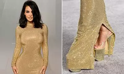 Kim Kardashian Struggles in Gold Gucci Gown at Vanity Fair Oscars Party