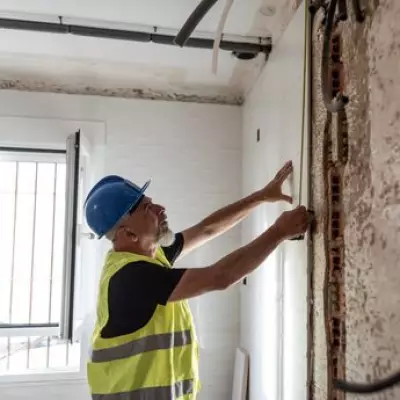 Man Discovers Hidden Safe Behind Kitchen Tiles, Finds Cash and iPhone