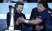 Princess Anne Shares Laugh with Rugby Captain in Playful Trophy Ceremony