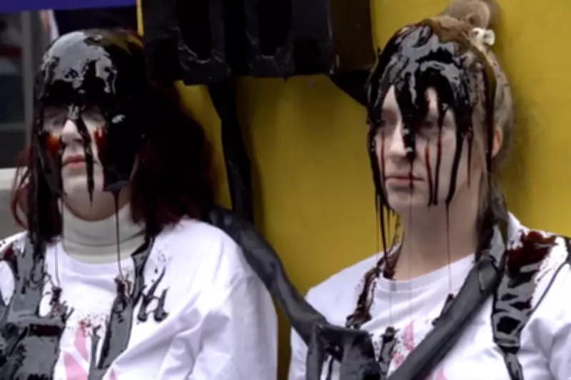 Climate Activists Douse in Treacle at US Embassy Protest Over Oil Profits