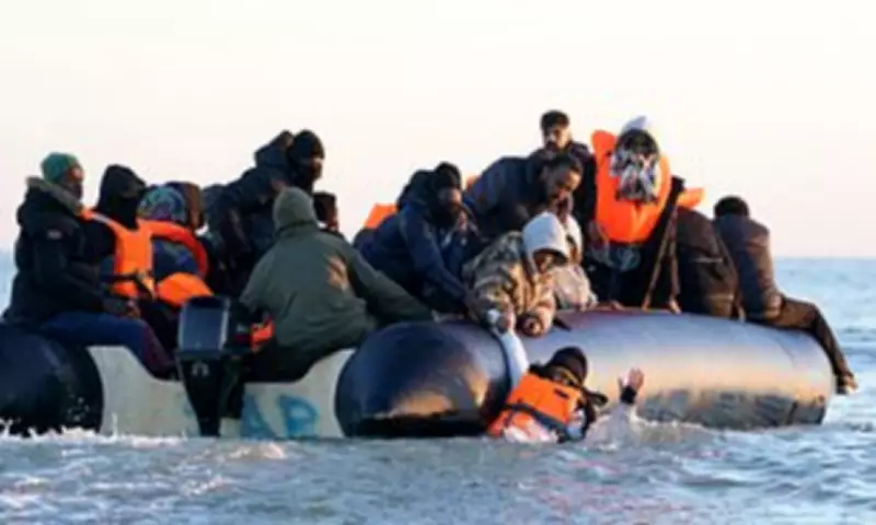 French Police Watch as Migrants Scramble Onto Dover-Bound Dinghy