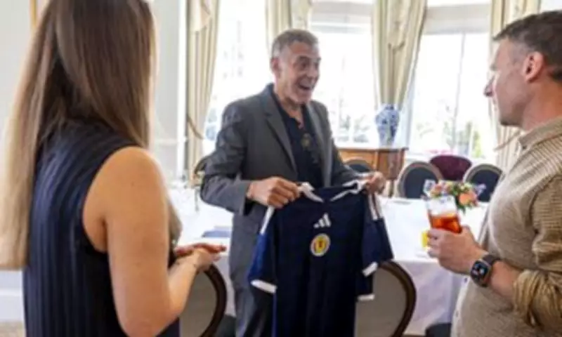 George Clooney Beams as He Receives Scotland Football Shirts for Family