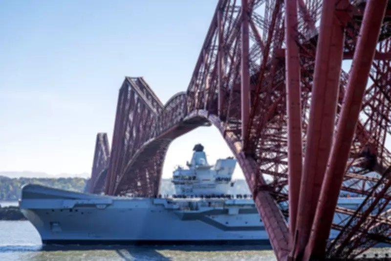 HMS Queen Elizabeth Sails Under Forth Bridge for Sea Trials