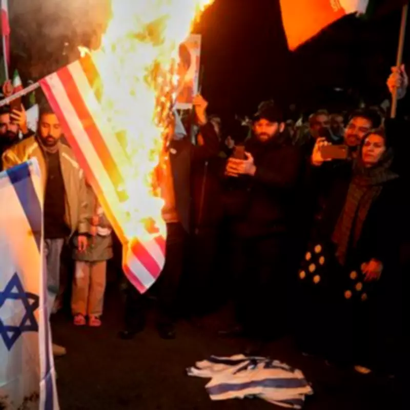 Iranian Protesters Burn US and Israeli Flags After Trump's Ceasefire Deal