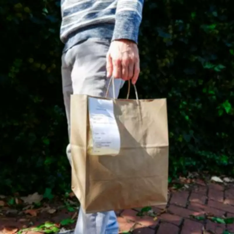 Man Stunned by Surprise Too Good To Go Bag from Ghost Kitchen