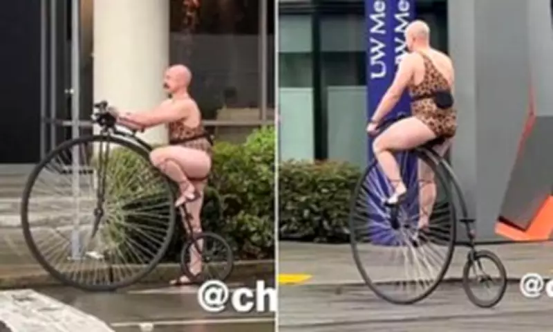 Seattle's Eccentric Penny-Farthing Rider in Leopard Print Leotard