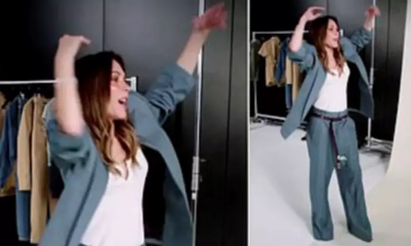 Victoria Beckham Dances in Slouchy Suit at GAP Photoshoot