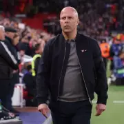 Carragher Reveals Slot's Liverpool Future Hinges on Champions League Qualification