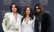 Elizabeth Hurley Stuns at Olivier Awards with Billy Ray Cyrus and Son