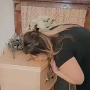 Exclusive: Daughter Kissed Father's Coffin, Now Fears It Was Empty