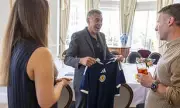 George Clooney Beams as He Receives Scotland Football Shirts for Family