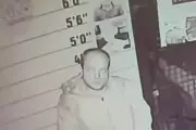 Intruder's Museum Rampage Ends with Ironic Mugshot Pose at Crime Exhibit
