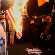 Iranian Protesters Burn US and Israeli Flags After Trump's Ceasefire Deal