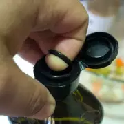 Olive Oil Bottle Tabs Have a Secret Second Use to Prevent Messy Spills
