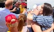 Prince Harry Jokes 'Easy, Easy' as Meghan Hugs Lifeguard in Australia