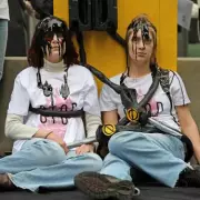 Protesters Chain Themselves to Fake Fuel Pump at US Embassy Over Trump's Iran War