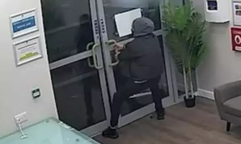 Bungling burglar caught on CCTV struggling with locked doors after theft