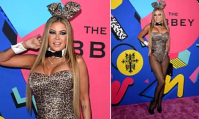 Carmen Electra Pays Homage to Playboy Roots in Leopard Leotard and Bunny Ears