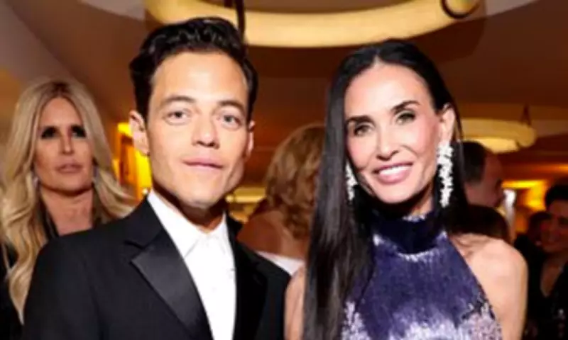 Demi Moore Stuns in Purple Sequin Gown at Red Sea Film Gala with Rami Malek