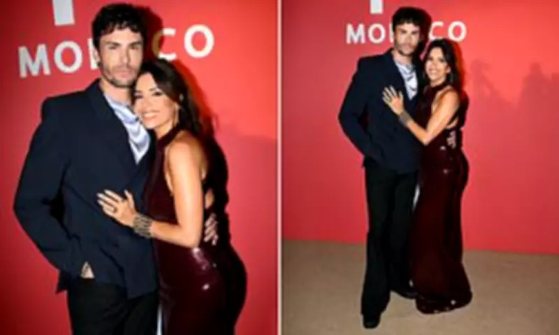Eva Longoria Stuns in Red Gown at Cannes Event with Model Baptiste Giabiconi