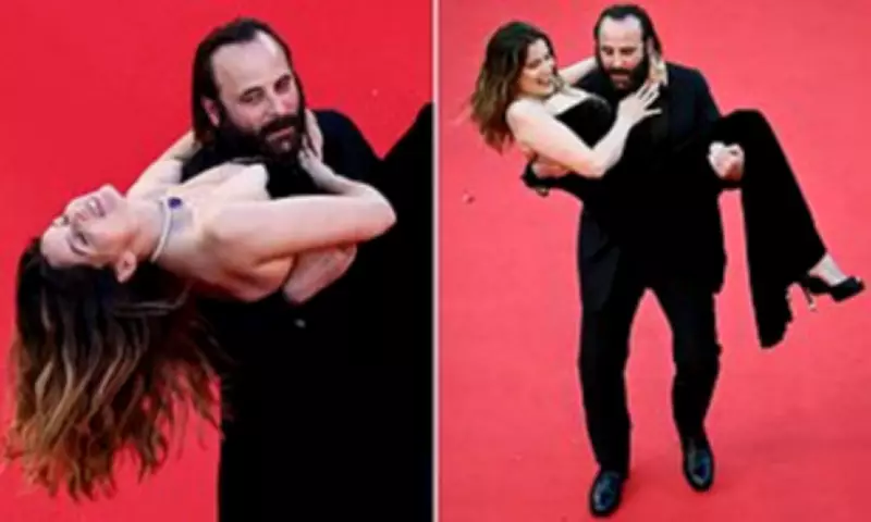 French Actor Carries Model Up Cannes Red Carpet at Karma Premiere