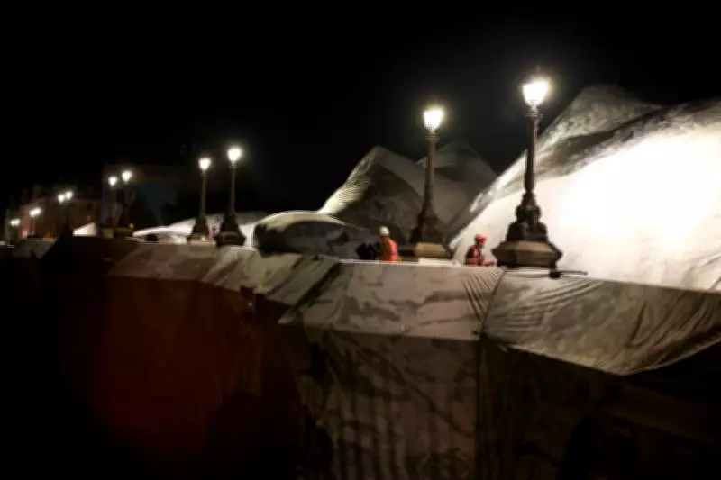 French Artist JR Inflates Giant 'Cave' Over Paris' Oldest Bridge