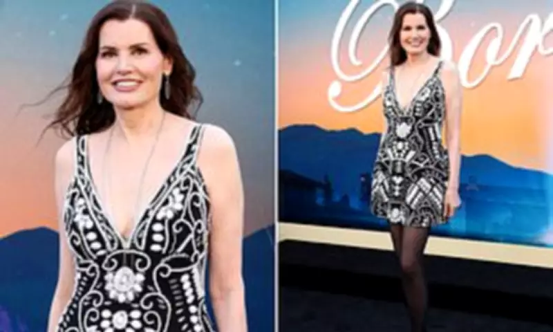 Geena Davis, 70, Stuns in Plunging White Beaded Mini Dress at The Boroughs Premiere