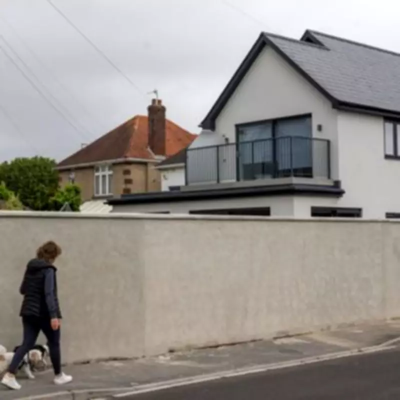 Homeowner's 75ft 'Berlin Wall' Angers Neighbours in Affluent Dorset